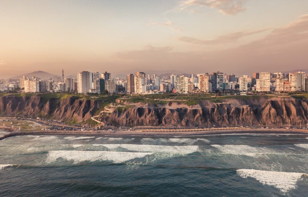 Aerial shot of the iconic Miraflores cliffs and coastline in Lima, Peru