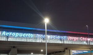 Exterior of the Jorge Chavez International Airport in Lima Peru, with lighted signage